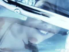 Asa Akira teases the camera and fingers herself
